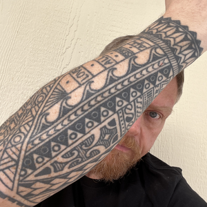 The outside of my arm, including the Ohio band. I don’t really get to see this side very well. There’s also a band of ocean waves, which represents travel.