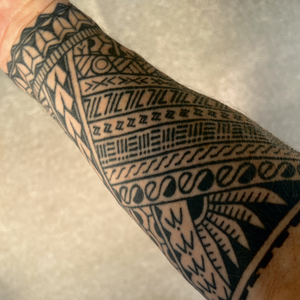 The inside of my arm, with the four bands representing the four members of my family visible