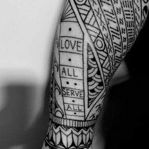 This section represents the neck of a guitar and contains the words LOVE ALL SERVE ALL, a nod to Hard Rock Cafe.