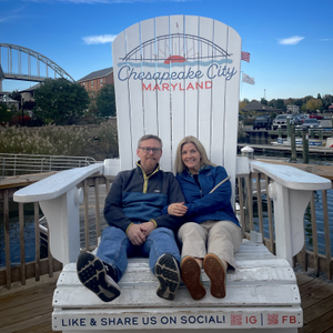 My wife and I pose in the big chair, Chesapeake City, Maryland (2024-10-26)